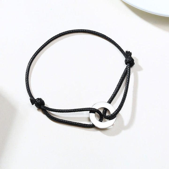 Schwarzes verstellbares Karma-Armband mit silbernem Kreisanhänger, spiritueller Yoga-Schmuck.