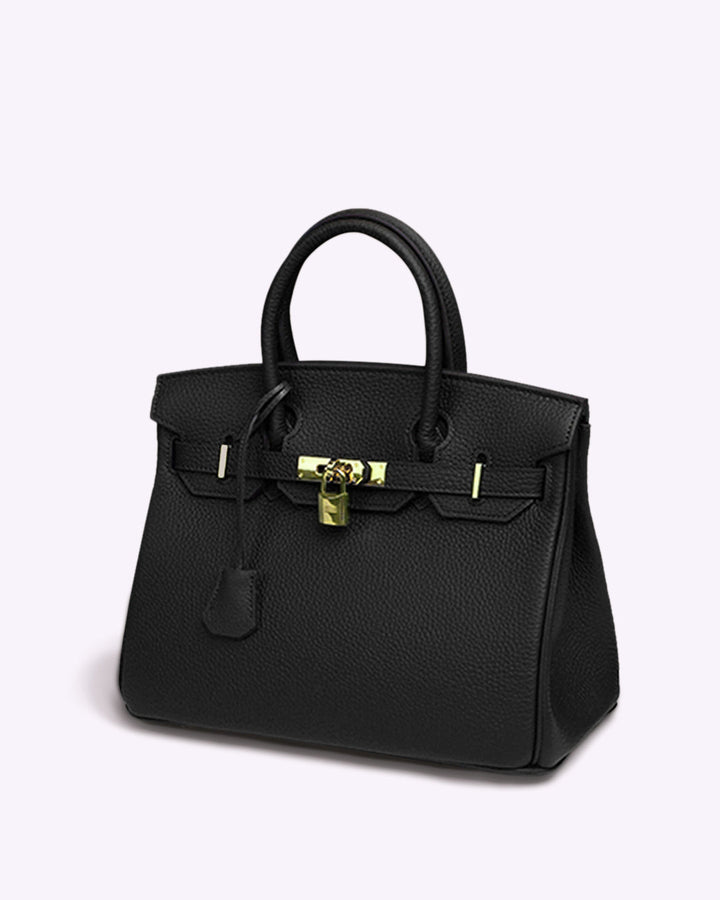 Schwarze Lederhandtasche mit goldener Hardware, elegante Damenmode, luxuriöses Accessoire.
