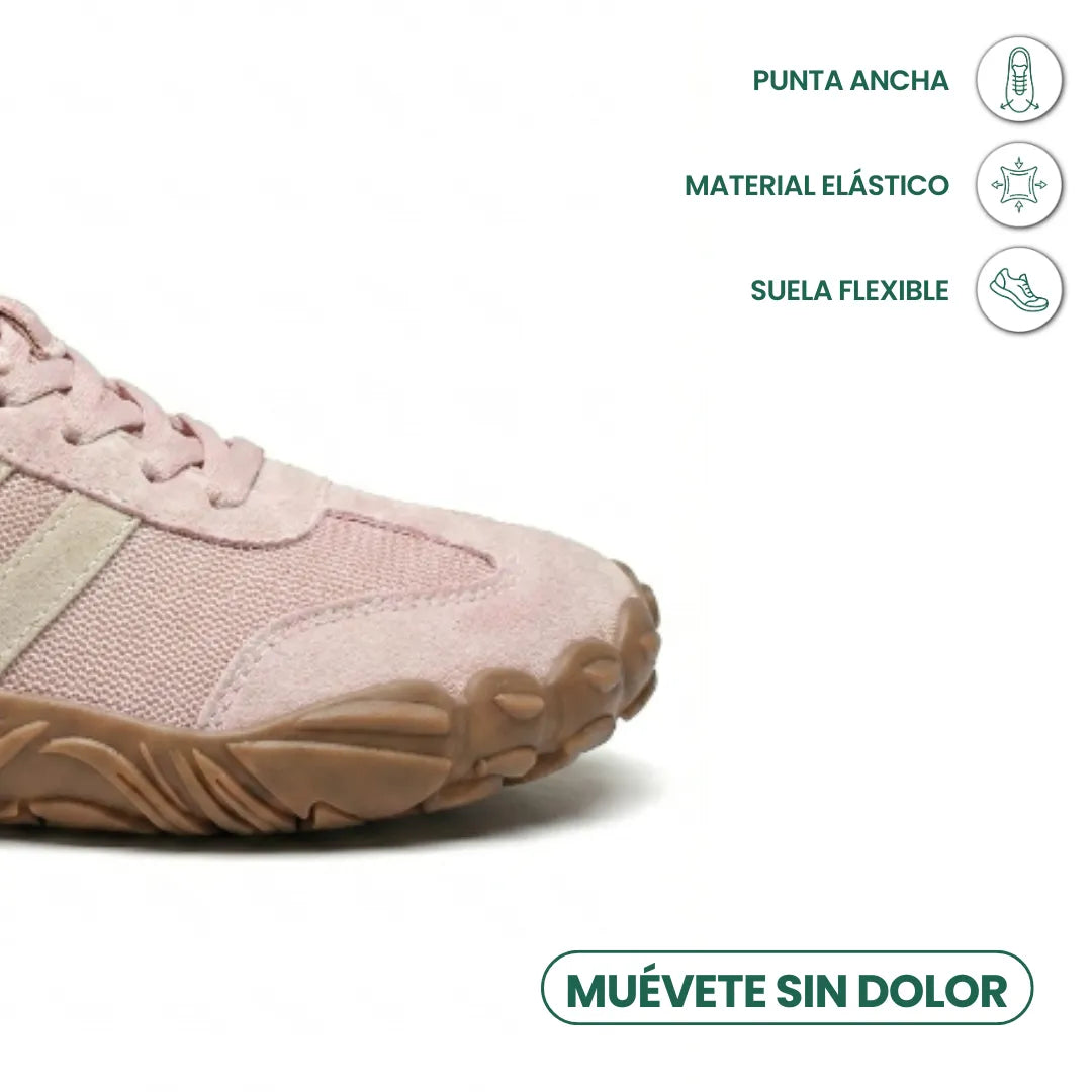Detail široké špičky růžové tenisky s flexibilní hnědou podrážkou, doplněný ikonami s popisem vlastností. 14