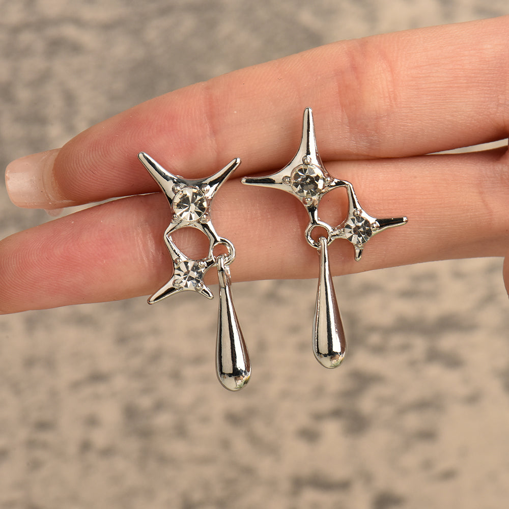 Silberne Tropfen-Ohrringe mit Kristallen, modische Damen-Accessoires, elegantes Design.