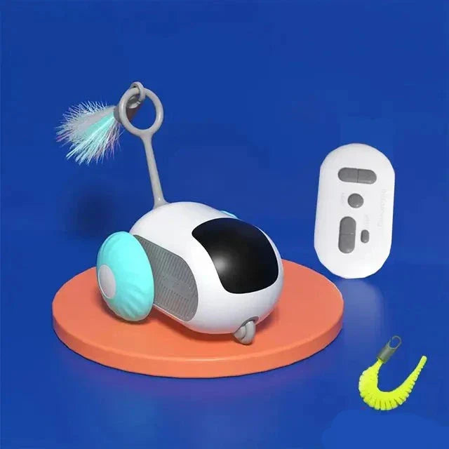 Weißes Katzenspielzeug mit Federn und Fernbedienung auf blauem Hintergrund.