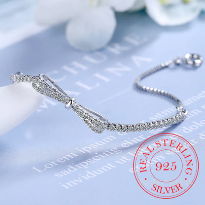 Silberarmband mit Schleife, Zirkonia, 925 Sterling Silber, Damen-Schmuck, elegant, funkelnd.