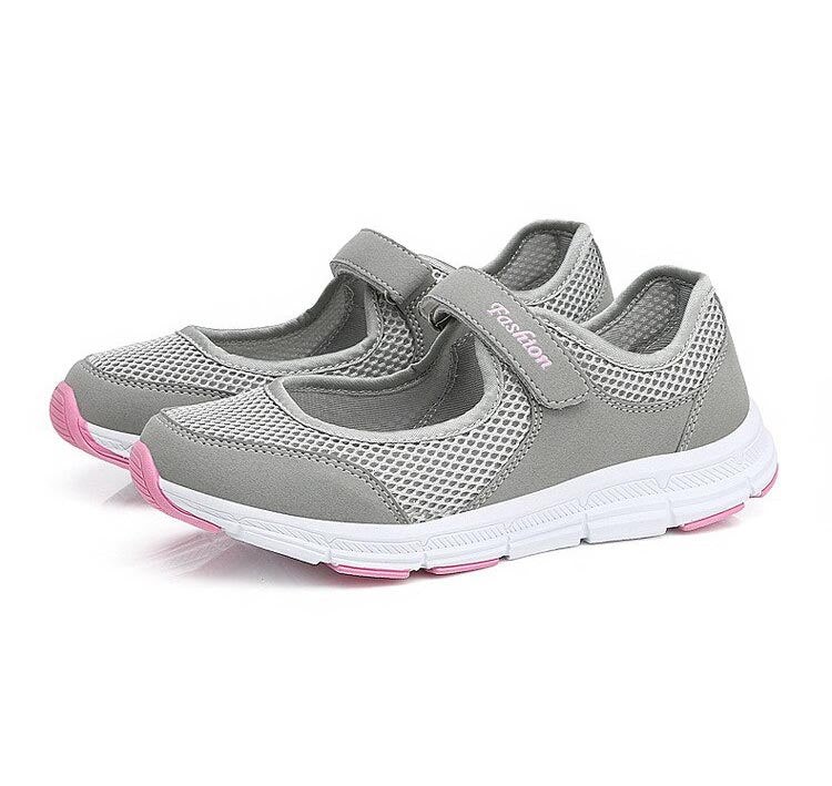 Graue Mesh-Sneaker Damen, atmungsaktiv, bequem, Klettverschluss, rosa Akzente.