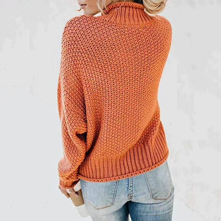 Frau in orangefarbenem Strickpullover, Rollkragen, lange Ärmel, lässig, modisch.