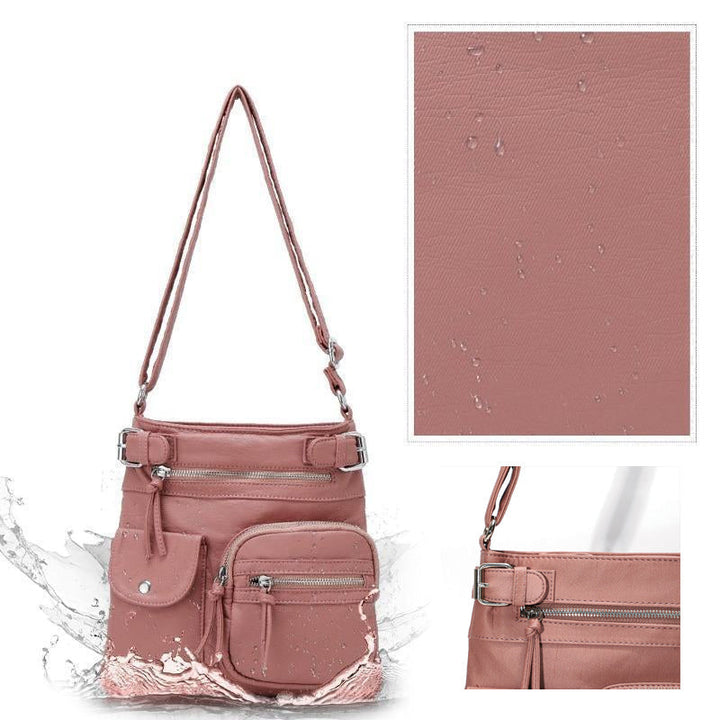 Rosa, wasserdichte, multifunktionale Anti-Diebstahl-Tasche mit mehreren Reißverschlusstaschen.