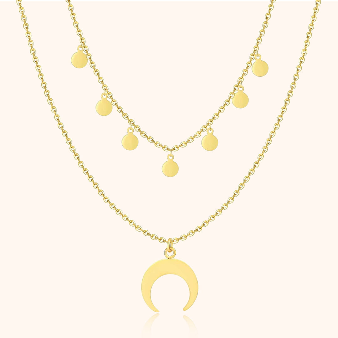 Goldene Halskette mit Halbmond-Anhänger und runden Anhängern, modischer Schmuck.