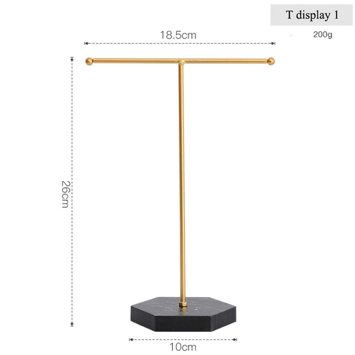 Goldener T-förmiger Schmuckständer aus Metall mit schwarzem Sockel, ideal für Ohrringe.