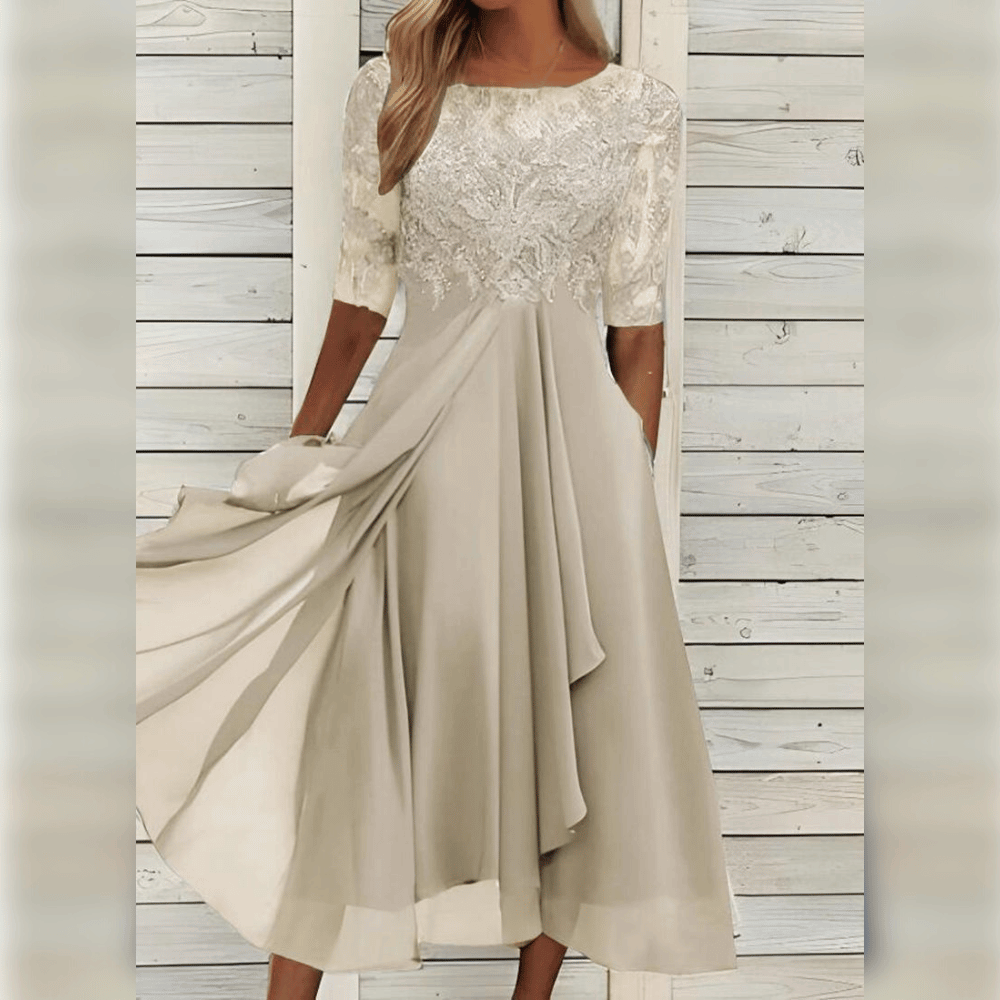 Elegantes cremefarbenes Spitzenkleid, knielang, mit halben Ärmeln, ideal für festliche Anlässe.
