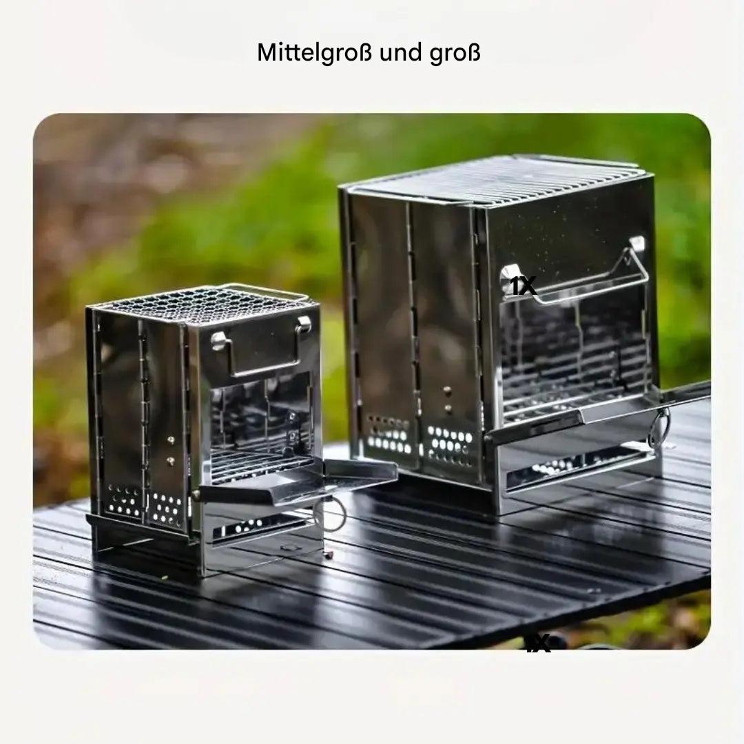 Zwei Edelstahl-Holzöfen, klappbar, für Camping, Outdoor, auf Tisch im Freien.