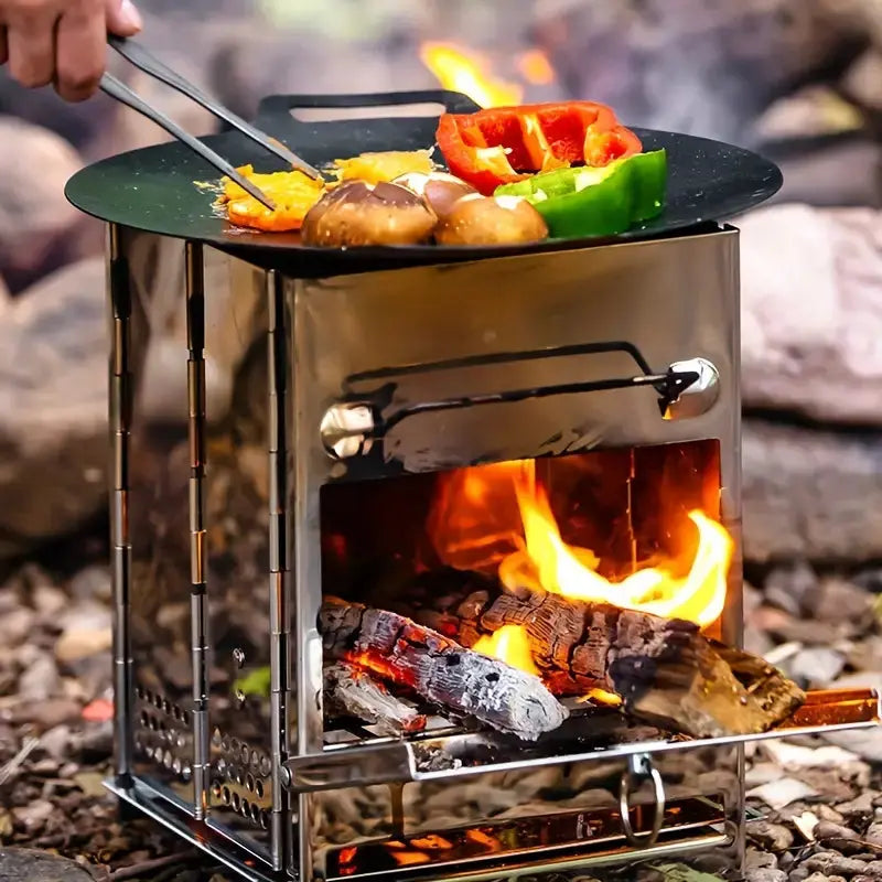 Tragbarer Edelstahl-Holzofen mit Grill, ideal fürs Camping und Outdoor-Kochen.