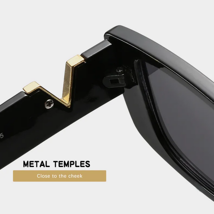 Schwarze Retro-Katzenaugen-Sonnenbrille mit Metallbügeln, modisches Accessoire.