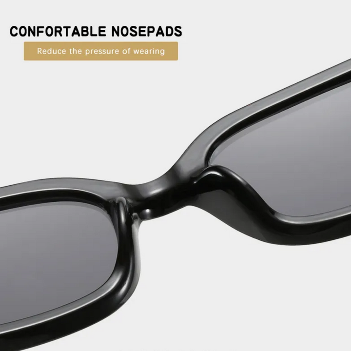 Schwarze Retro-Katzenaugen-Sonnenbrille mit bequemen Nasenpads, modisches Accessoire.