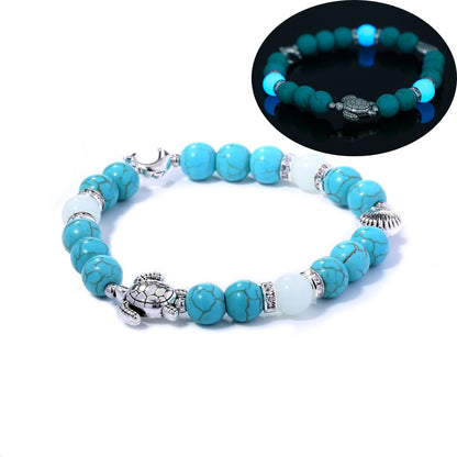 Türkisfarbenes Armband mit Schildkrötenanhänger, leuchtende Perlen, Damen Schmuck, Geschenkidee.