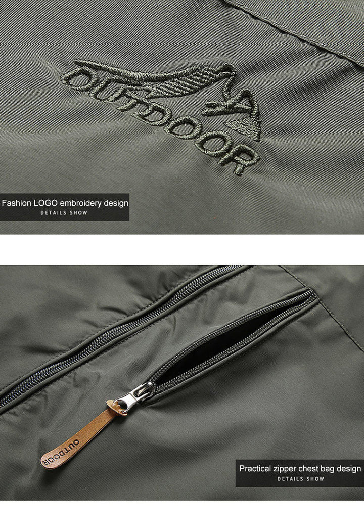 Grüne Outdoor-Jacke mit gesticktem Logo und praktischem Reißverschluss auf der Brusttasche.