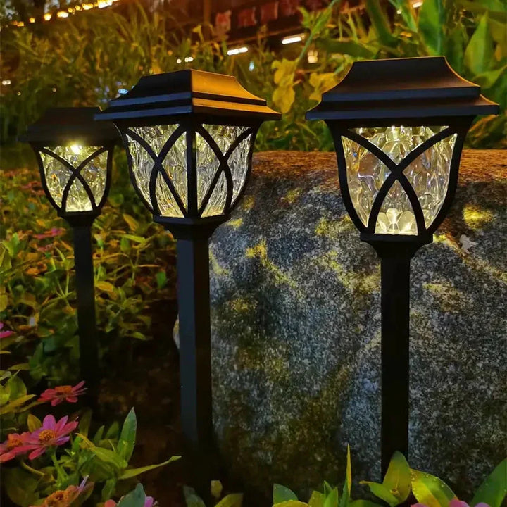 Schwarze Solar-Gartenleuchten, LED, wetterfest, dekorativ, beleuchten Blumenbeet bei Nacht.