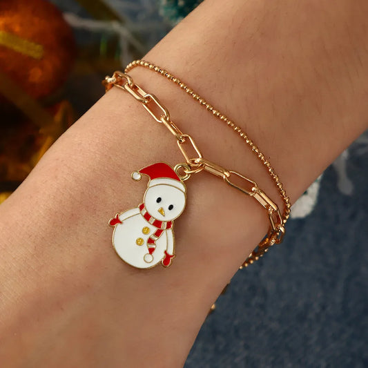Goldenes Armband mit Schneemann-Anhänger, Weihnachtsdesign, Damenmode-Schmuck.