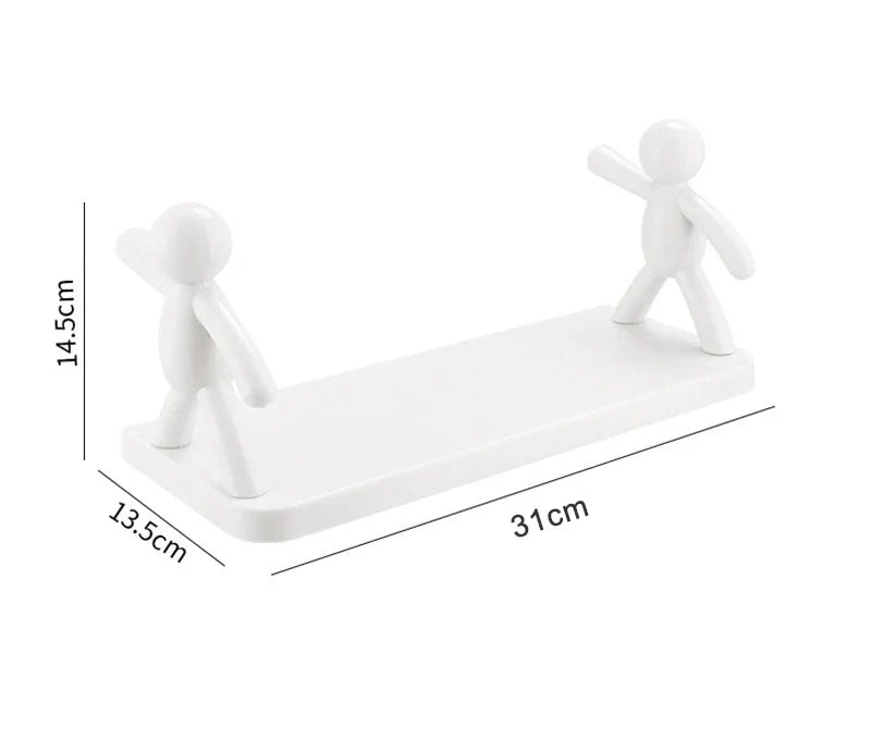 Weiße Kunststoff-Handyhalterung mit Figuren, 31x13,5x14,5 cm, minimalistisches Design.