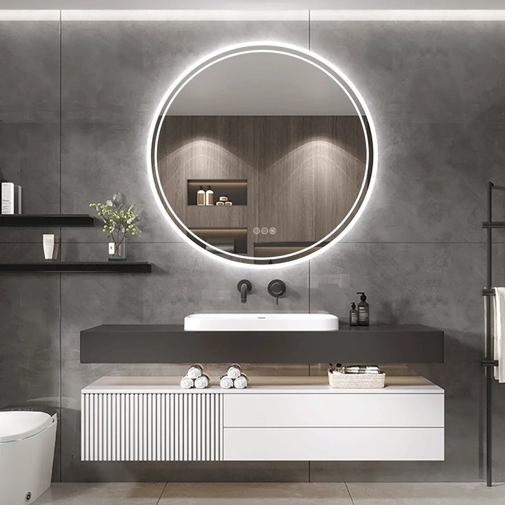Runder LED-Badezimmerspiegel, beleuchtet, modernes Design, über Waschbecken, graue Wand.