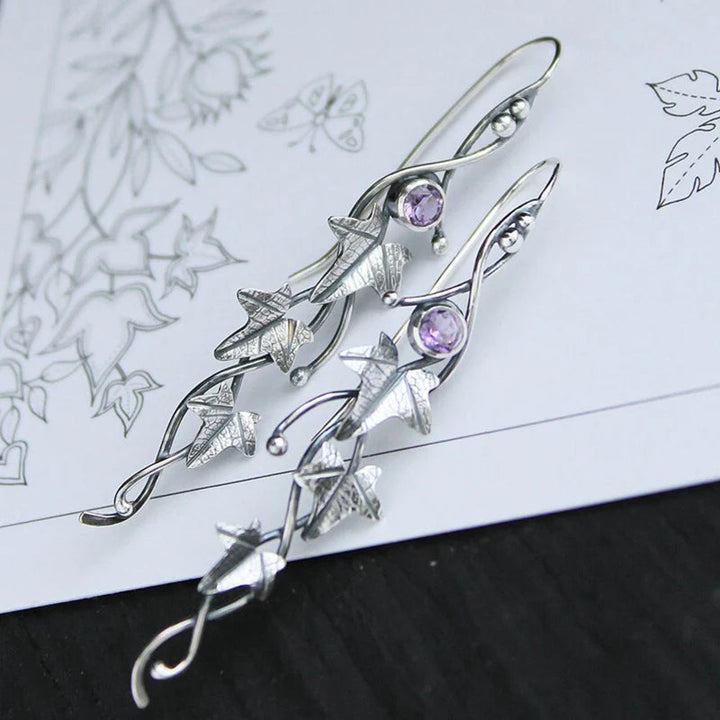 Silberne Ohrringe mit lila Kristallen, florales Design, handgefertigter Schmuck.