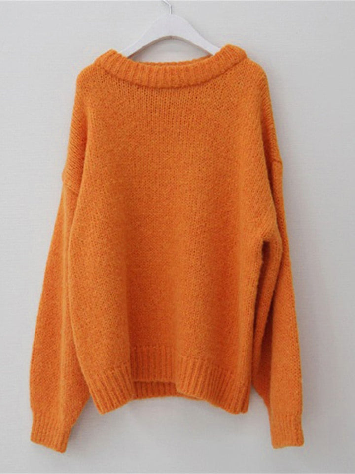 Orangefarbener Strickpullover aus Wolle, Damenmode, Herbst-Winter, gemütlich, lässig.