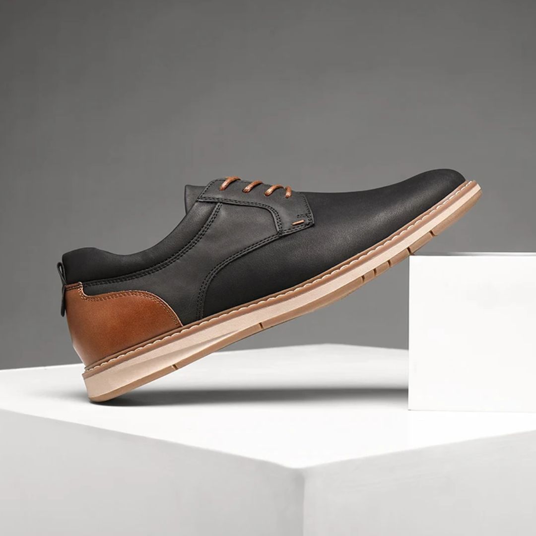 Schwarzer und brauner Herrenschuh aus Leder, elegantes Design, rutschfeste Sohle.