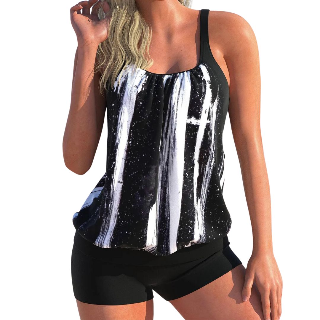 Frau in schwarz-weißem Tankini-Set, ärmellos, sportlich, Strandmode, Sommerbekleidung.