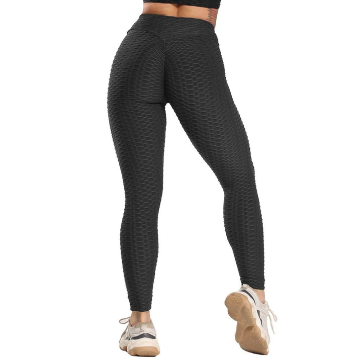 Damen Sportleggings, schwarz, nahtlos, strukturierte Oberfläche, hohe Taille, Fitnessmode.