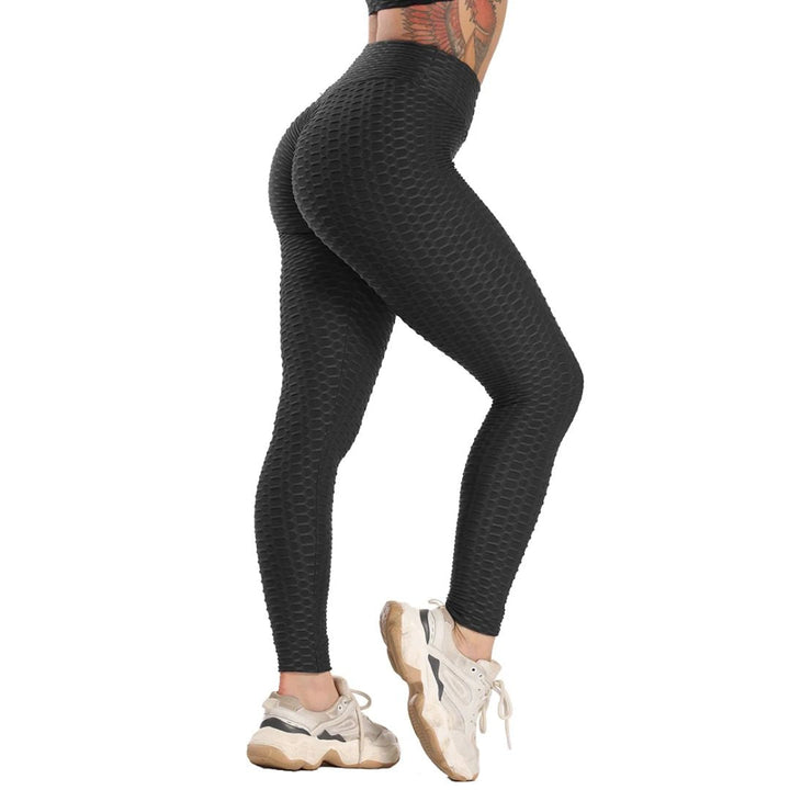Schwarze nahtlose Leggings, strukturierte Oberfläche, Damenmode, Sportbekleidung.
