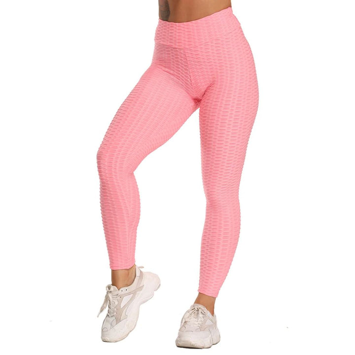 Frau in rosa nahtlosen Leggings und weißen Turnschuhen, Sportbekleidung, Fitnessmode.
