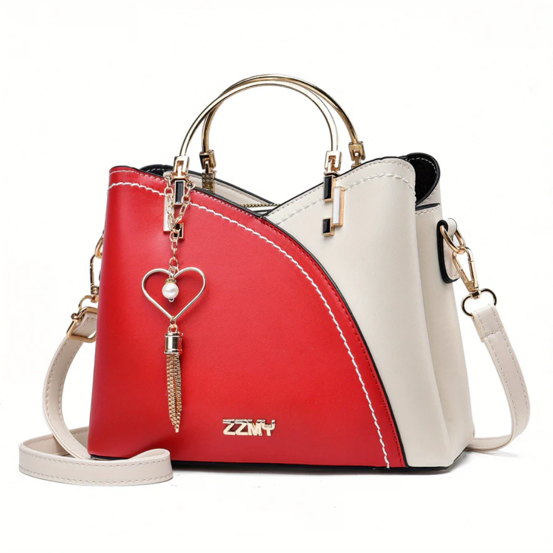 Rot-weiße Damenhandtasche mit Herzanhänger, Leder, modisch, elegant, Umhängetasche.