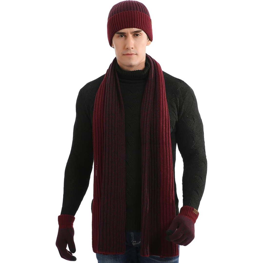 Mann mit weinrotem Strickmütze, Schal und Handschuhen, schwarzer Pullover, Wintermode.