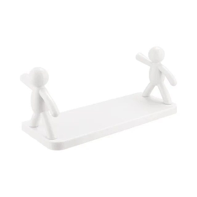 Weiße Buchstütze aus Kunststoff mit zwei Figuren, modernes Design, minimalistisch, Regalhalter.