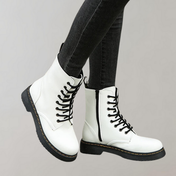 Weiße Damenstiefel aus Leder mit schwarzer Schnürung, modisch, robust, bequem.