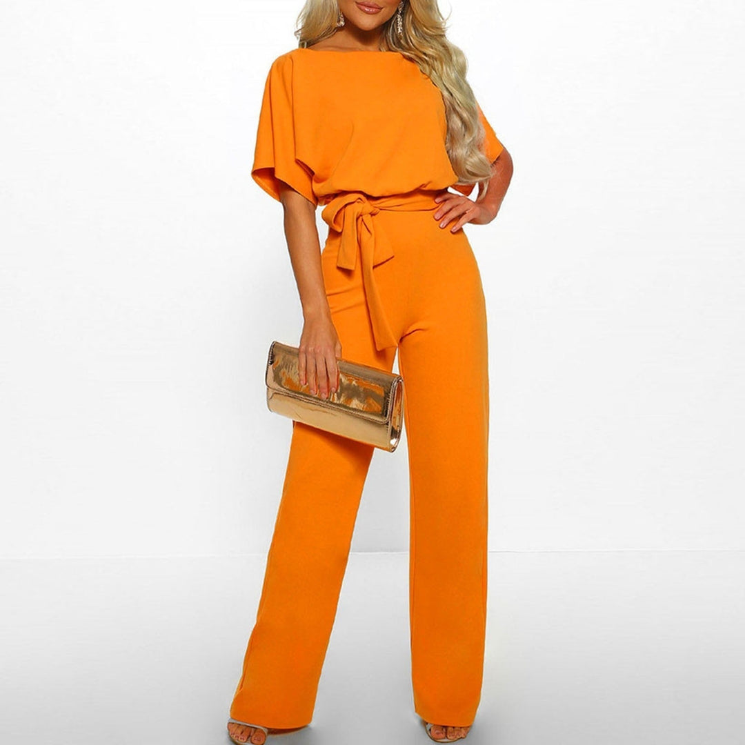 Eleganter gelber Damen-Jumpsuit mit Gürtel, modisch, lang, ideal für Sommeranlässe.