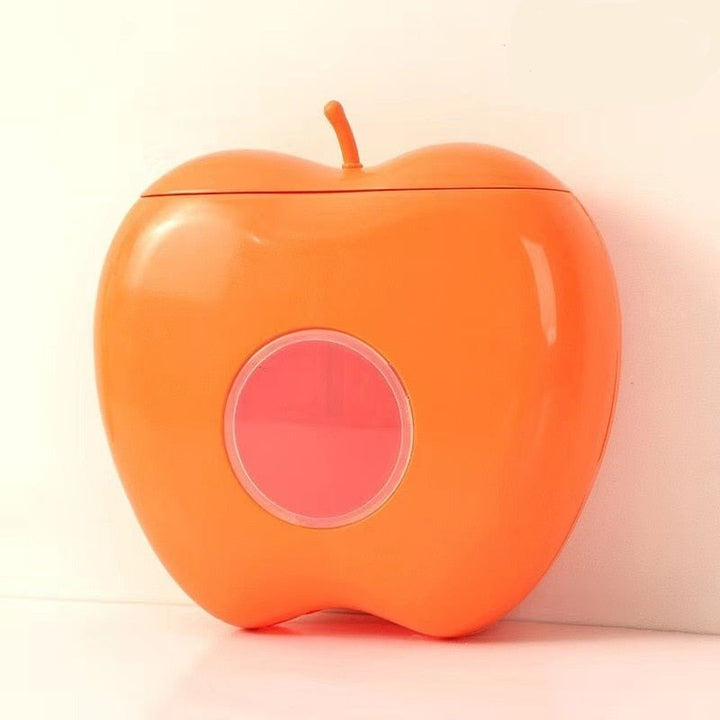 Orangefarbene Apfel-förmige Aufbewahrungsbox aus Kunststoff mit rundem Sichtfenster.
