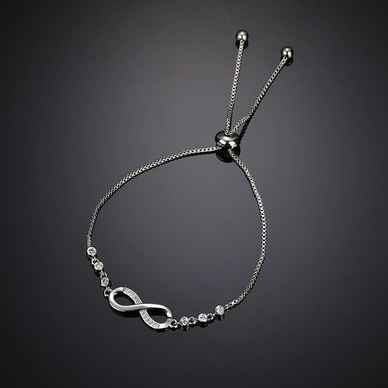 Silbernes Armband mit Unendlichkeitssymbol, verstellbar, mit Kristallen, eleganter Schmuck.