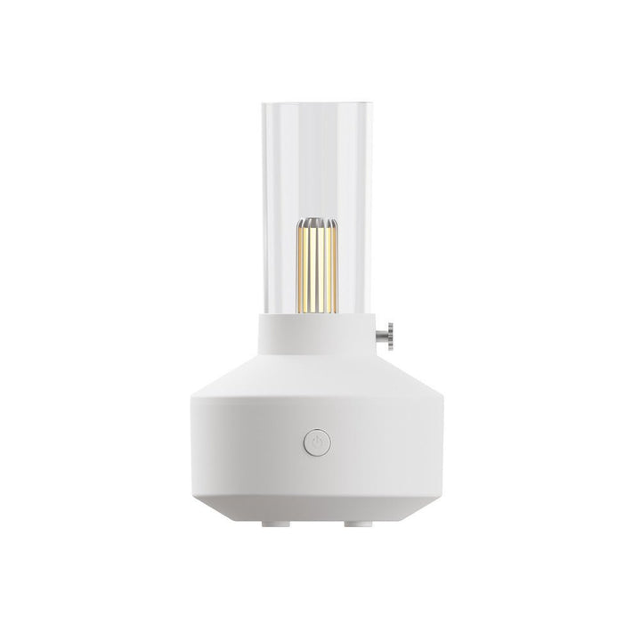 Weißer Aromatherapie-Diffuser mit LED-Kerzenlicht, modernes Design, Raumduftgerät.