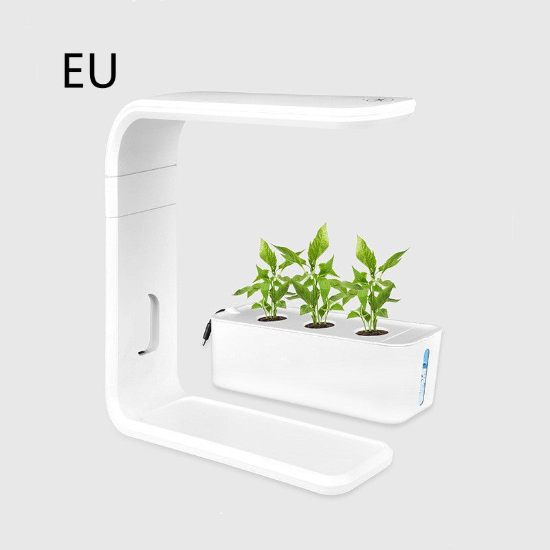 Weiße LED-Pflanzenlampe mit drei grünen Setzlingen, modernes Design, EU-Stecker.