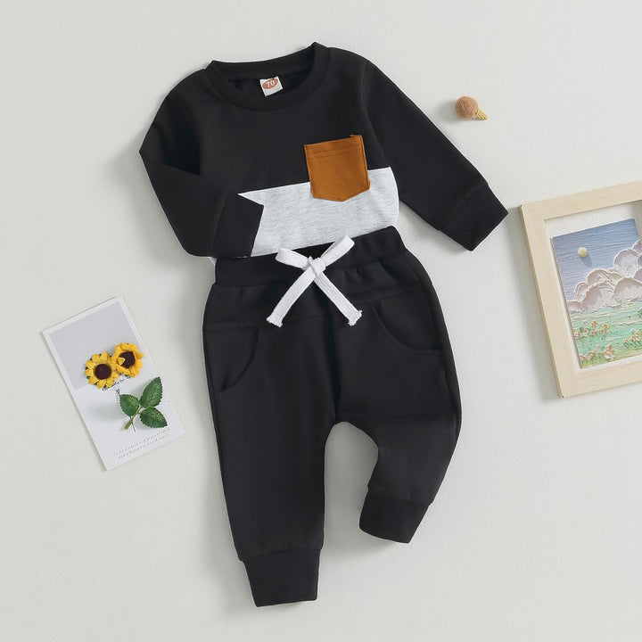 Schwarzer Baby-Strampler mit brauner Tasche, weißem Streifen, Baumwolle, Langarm, Unisex.