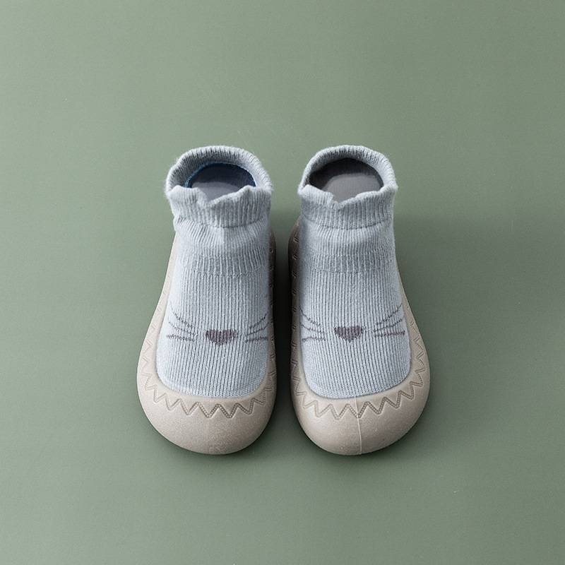 Graue Babyschuhe mit Katzengesicht, rutschfest, weiches Material, ideal für Kleinkinder.