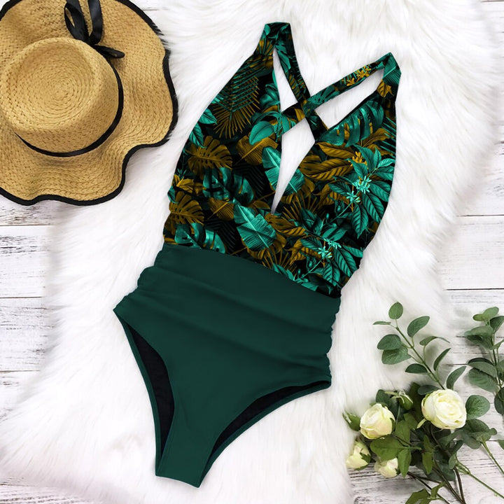 Grüner Badeanzug mit tropischem Muster, Damenmode, Sommer, Strandkleidung, elegant, stilvoll.