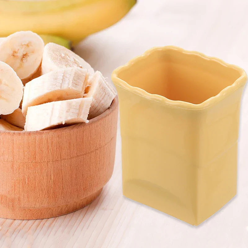 Gelber Becher-Schneider für Obst und Gemüse, ideal zum Schneiden von Bananen und Erdbeeren.