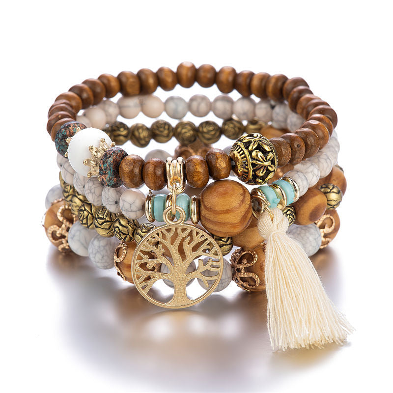 Mehrlagiges Armband mit Holzperlen, Baum-Anhänger und Quaste, Boho-Stil, Damen-Schmuck.