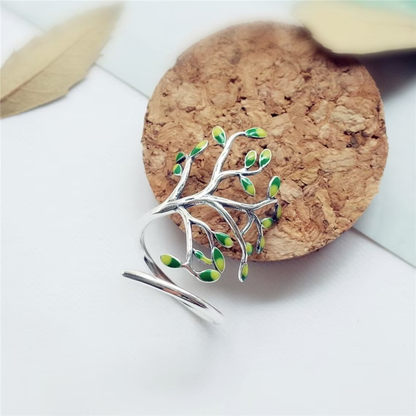 Silberner Baumring mit grünen Blättern, verstellbar, modisches Schmuckstück, Damenaccessoire.