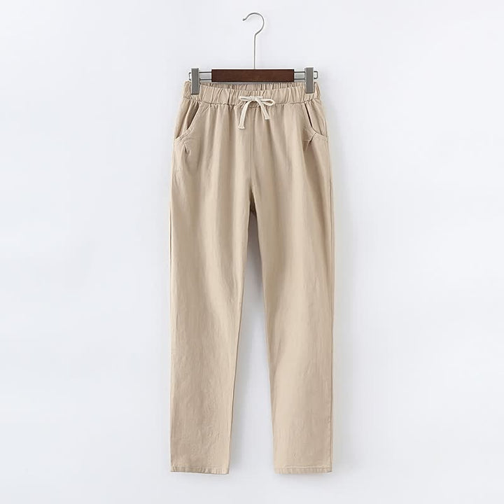 Beige Damenhose aus Baumwolle mit elastischem Bund und Kordelzug, lässiger Stil.