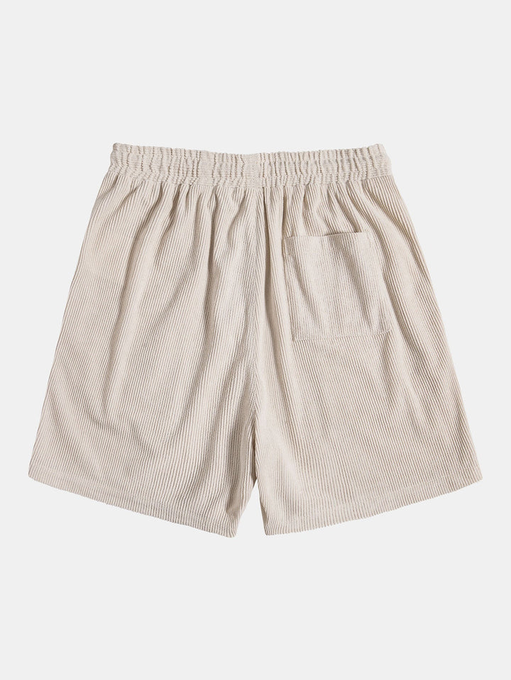 Beige gestreifte Shorts aus Baumwolle mit elastischem Bund und Tasche, ideal für Sommermode.