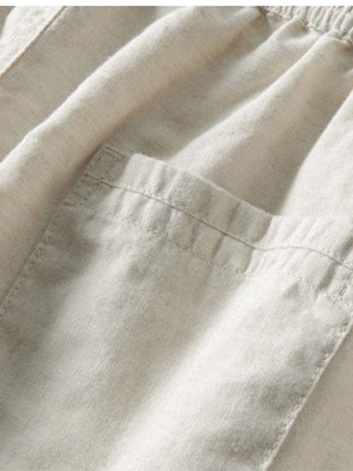 Beige Leinenhose mit elastischem Bund und Tasche, ideal für Sommermode und Freizeitkleidung.