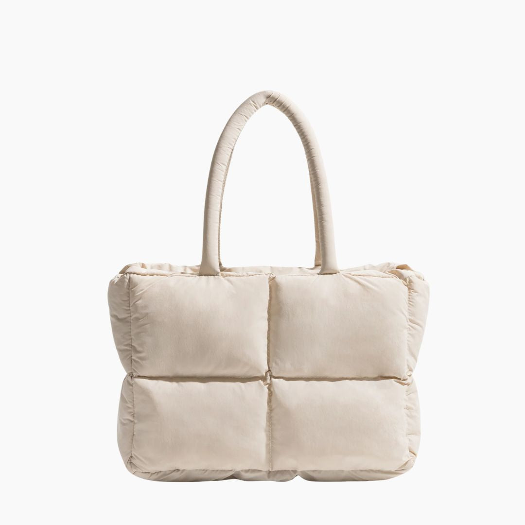 Beige gesteppte Handtasche, Damen, modisch, elegant, aus Stoff, mit Henkeln, quadratisches Design.
