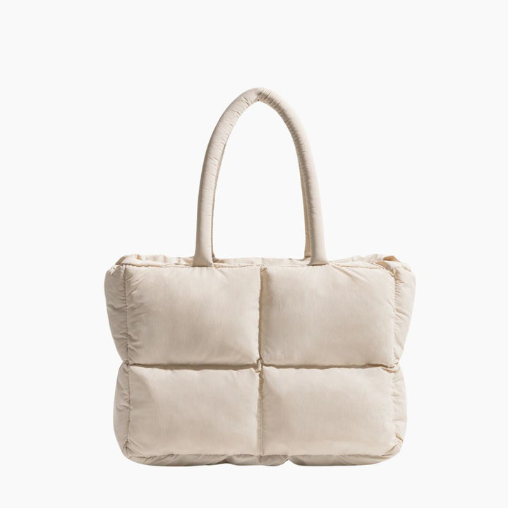 Beige gesteppte Handtasche, Damen, modisch, elegant, aus Stoff, mit Henkeln, quadratisches Design.