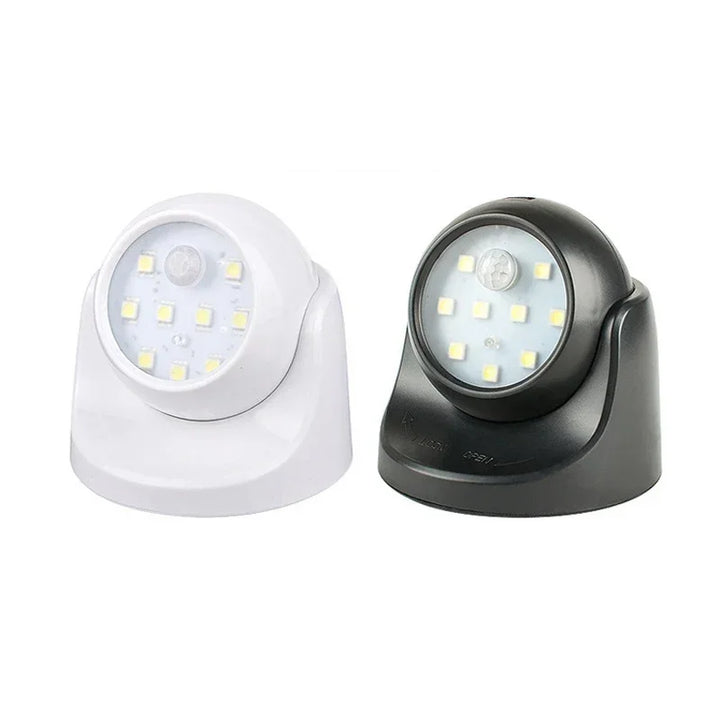 Zwei LED-Nachtlichter, schwarz und weiß, batteriebetrieben, für Innenbeleuchtung.